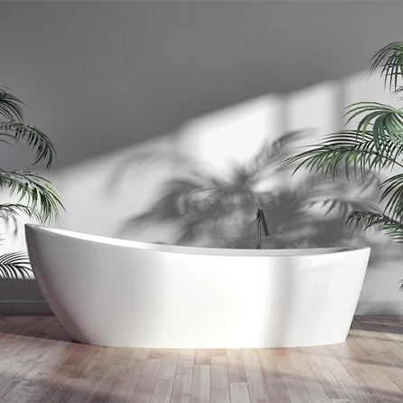 Zdjęcie przedstawia wnętrze utrzymane w odcieniach szarości – szare ściany i podłoga tworzą eleganckie, spokojne tło. W centralnej części stoi wolnostojąca biała wanna, która wyraźnie kontrastuje z ciemniejszym otoczeniem. Obok znajdują się zielone kwiaty, które ożywiają przestrzeń i dodają jej świeżości. Całość wygląda nowocześnie i minimalistycznie.